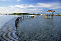 Footbridge with a nipa house in the resort, Siargao, Philippines - OTHK