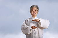 Older woman doing martial arts. - Yukmin