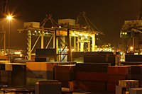 Night shot of shipping yard and containers, Singapore - Nugene Chiang