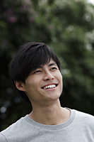 Head shot of Chinese man smiling and looking up - Yukmin