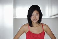 young woman wearing red top and smiling - Yukmin
