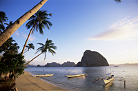 Philippines,Palawan,Bascuit Bay,El Nido,Outriggers on Tropical Beach - Travelasia