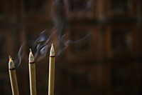 Incense sticks burning with smoke - Alex Mares-Manton