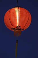 Red lantern glowing at night - Alex Mares-Manton