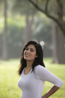 Half shot of Indian woman smiling outdoors - Alex Mares-Manton