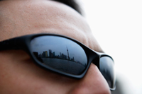 Shanghai skyline reflected in sunglasses. - Yukmin