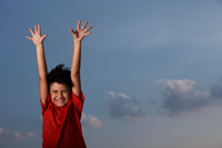 young boy with red shirt smiling with hands outstretched - Yukmin