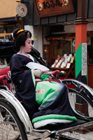 Geisha in Rickshaw in front of Asakusa Kannon Temple. Japan,Tokyo - Travelasia
