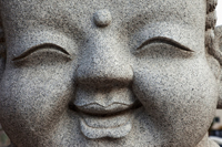 Jogyesa Temple, close up of stone Buddha statue. Seoul, Korea - Travelasia