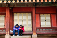 Gyeongbokgung Palace,Couple with Mobile Phones, Seoul, Korea - Travelasia