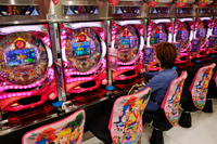 Person playing Pachinko machine. Japan,Tokyo,Shinjuku, - Travelasia