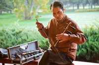 China,Beijing,Temple of Heaven Park,Man Playing Erdu Traditional Stringed Instrument - Travelasia