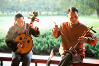 China,Beijing,Temple of Heaven Park, Man and Woman Playing Traditional Chinese Stringed Instruments - Travelasia