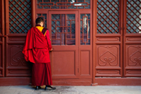 Tibetan Lama Temple or Yonghe Gong, Monk Opening Door. Beijing China - Travelasia