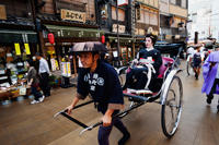 Geisha in Rickshaw on busy street. Japan,Tokyo - Travelasia