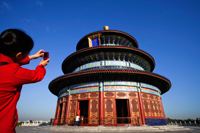 Temple of Heaven or Tiantan,Girl Taking Photo of Hall of Prayer for Good Harvests. Beijing, China - Travelasia
