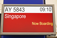 Airport departure sign for Singapore, Hong Kong International Airport - Travelasia