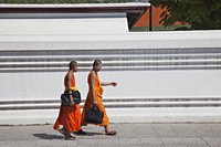 Monks walking along street in Bangkok, Thailand - Travelasia