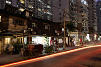 Light trail from a car on a street in Shanghai at night, China - Yukmin