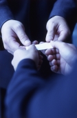 Hands exchanging business card, close up - Keith Brofsky