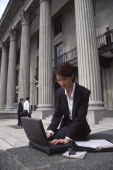 Female executive working on laptop computer - Alex Microstock02