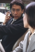 Male executive in car talking on cellular phone - Alex Microstock02