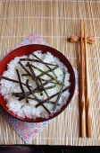 Japan, bowl of Japanese rice in table setting - Rex Butcher
