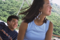 Teenagers on boat, smiling - Jade Lee