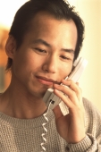 Man talking on telephone - Jade Lee