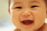 Baby boy (3 - 9 months old), laughing, close up - Keith Brofsky