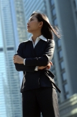Female executive standing, profile - Gareth Brown