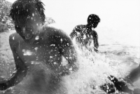 Teenagers splashing in the ocean - Jade Lee