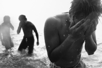 Teenagers wading in the ocean - Jade Lee