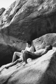 Two teenagers sunbathing on rocks - Jade Lee