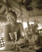 Woman at restaurant, smiling - Jack Hollingsworth