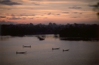 Vietnam, near Hue, boats on Perfume River at sunset. - Steve Raymer