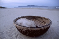 Vietnam, Danang, bamboo fishing boat on China Beach. - Steve Raymer