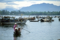 Vietnam, Danang, woman rowing sampan at Thu Bon River. - Steve Raymer