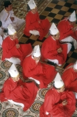 Vietnam, Tay Ninh, priests in red garments in Cao Dai Great Temple. - Steve Raymer