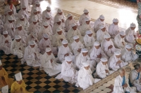 Vietnam, Tay Ninh, believers with white headbands in Cao Dai Great Temple. - Steve Raymer