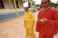 Vietnam, Tay Ninh, Cao Dai priests outside of Cao Dai Great Temple. - Steve Raymer