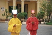 Vietnam, Tay Ninh, Cao Dai priests outside Cao Dai Great Temple. - Steve Raymer