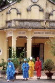 Vietnam, Tay Ninh, Cao Dai lay priests outside Cao Dai Great Temple. - Steve Raymer
