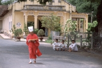 Vietnam, Tay Ninh, Cao Dai priest in red robe. - Steve Raymer