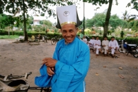 Vietnam, Tay Ninh, Cao Dai priest in blue robe. - Steve Raymer