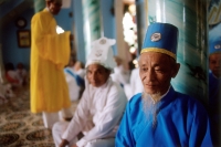 Vietnam, Tay Ninh, Cao Dai lay priests in Cao Dai Great Temple. - Steve Raymer
