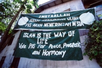 Malaysia, Kelantan, Kota Bahru, banner of Pan-Malaysian Islamic Party. - Steve Raymer