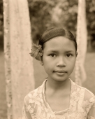 Indonesia, Bali, young girl with flower behind ear, portrait - Jack Hollingsworth