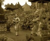 Indonesia, Bali, Balinese dancer in traditional costume, in garden - Jack Hollingsworth