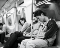 Young adults sleeping on train. - Jack Hollingsworth